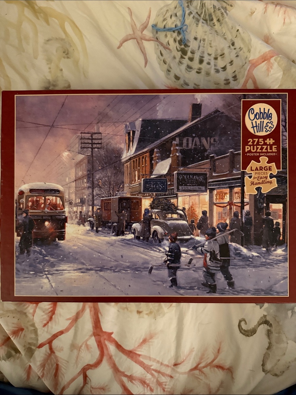 Cobble Hill Winter Street Scene 275-Piece Puzzle - Snowy Village “Hockey Night”